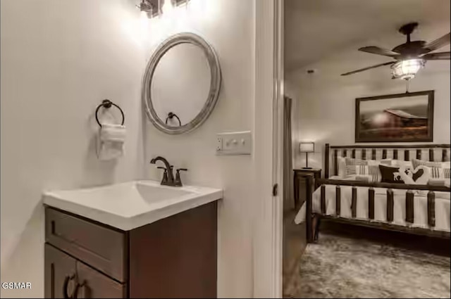 bathroom with a ceiling fan and vanity