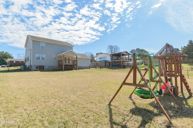 view of yard with a playground and fence