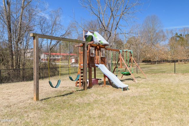 view of playground with fence and a yard