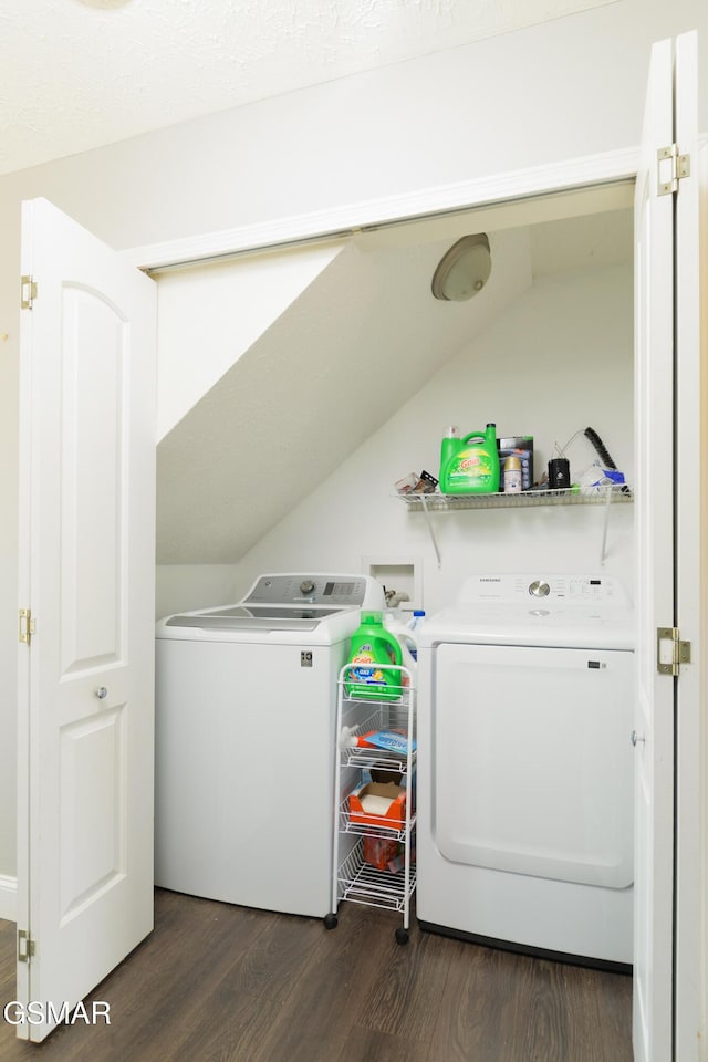 washroom with laundry area, separate washer and dryer, and dark wood-type flooring