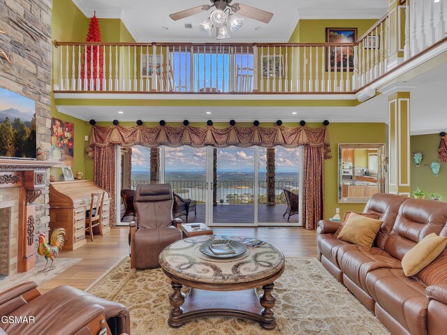 498 Proffitt Ridge Rd, Mooresburg, TN 37811 - living area with a ceiling fan, a towering ceiling, wood finished floors, and ornamental molding