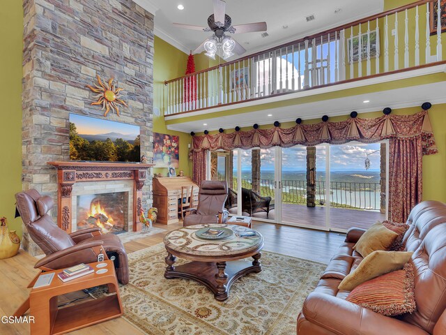 498 Proffitt Ridge Rd, Mooresburg, TN 37811 - living area featuring ceiling fan, healthy amount of natural light, a towering ceiling, ornamental molding, and wood finished floors