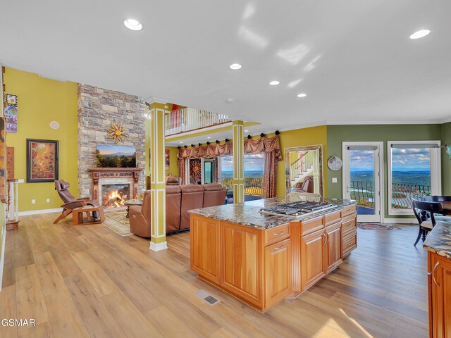 498 Proffitt Ridge Rd, Mooresburg, TN 37811 - kitchen with stainless steel gas stovetop, light wood-style flooring, recessed lighting, ornamental molding, and a fireplace