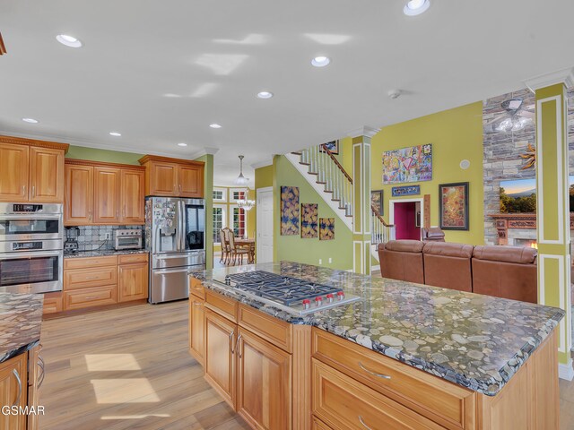 498 Proffitt Ridge Rd, Mooresburg, TN 37811 - kitchen with stainless steel appliances, light wood finished floors, tasteful backsplash, dark stone counters, and recessed lighting