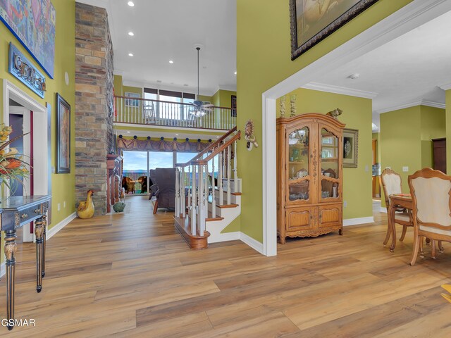 498 Proffitt Ridge Rd, Mooresburg, TN 37811 - entryway with crown molding, stairway, wood finished floors, recessed lighting, and a high ceiling