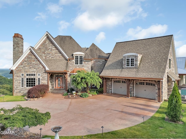 498 Proffitt Ridge Rd, Mooresburg, TN 37811 - view of front of property with stone siding, driveway, a chimney, a shingled roof, and a garage