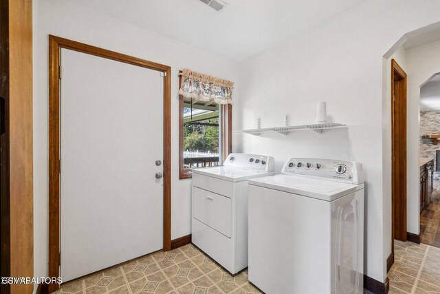 laundry room with washing machine and clothes dryer