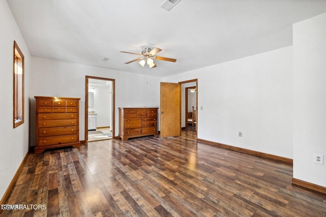 unfurnished bedroom with ceiling fan, dark hardwood / wood-style flooring, and ensuite bath