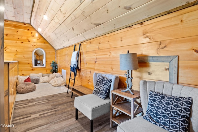 sitting room featuring vaulted ceiling, wood ceiling, wood finished floors, and wooden walls