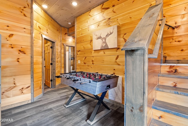 playroom featuring wood walls, wood finished floors, and recessed lighting
