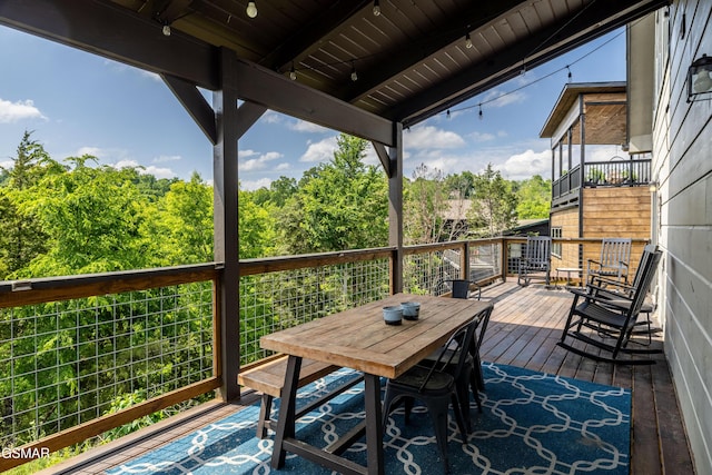 deck with outdoor dining space
