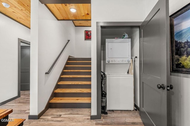 1105 Center St # 2, Sevierville, TN 37862 - laundry room with stacked washing machine and dryer, wooden ceiling, wood finished floors, and recessed lighting