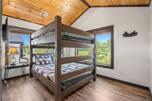 1105 Center St # 2, Sevierville, TN 37862 - bedroom featuring multiple windows, wood finished floors, vaulted ceiling, and wood ceiling