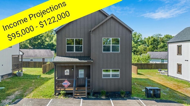 1105 Center St # 2, Sevierville, TN 37862 - back of property with board and batten siding, uncovered parking, and roof with shingles
