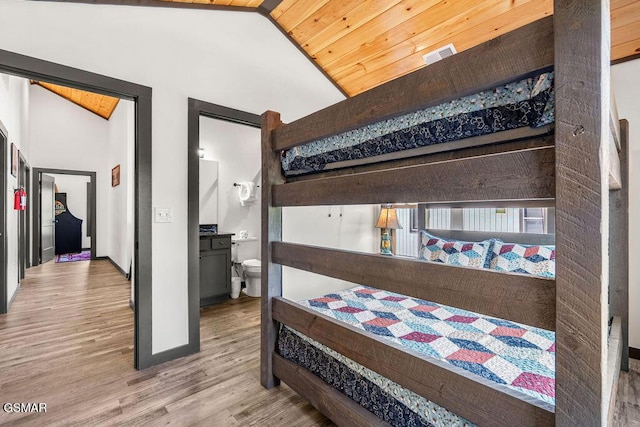 1105 Center St # 2, Sevierville, TN 37862 - bedroom featuring wood finished floors, wood ceiling, high vaulted ceiling, and connected bathroom