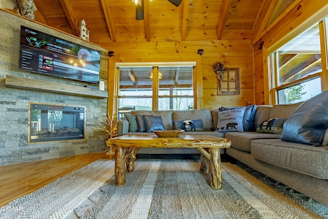 living room featuring wooden ceiling, a fireplace, lofted ceiling with beams, and wood finished floors