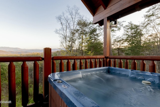 deck featuring a hot tub