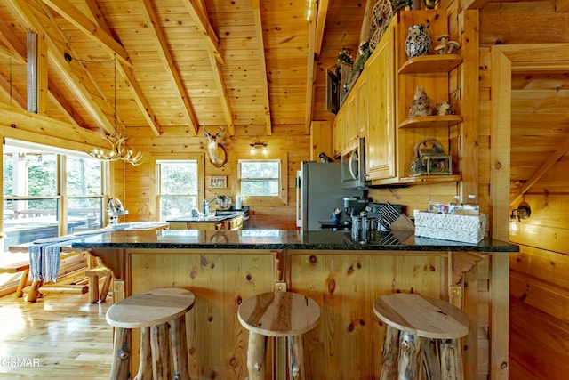 kitchen with open shelves, wooden walls, appliances with stainless steel finishes, wood ceiling, and vaulted ceiling with beams