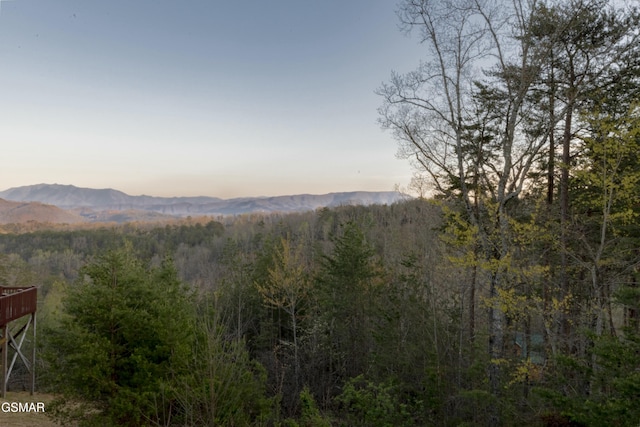 mountain view featuring a forest view