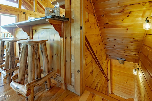 interior space featuring wooden walls and wood finished floors