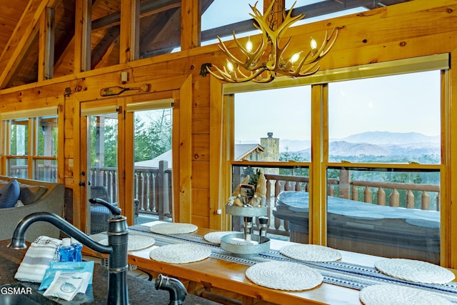 dining space featuring an inviting chandelier and a mountain view