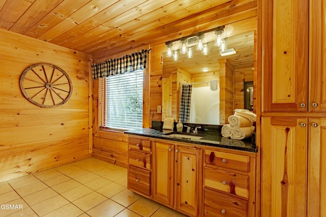 bathroom featuring tile patterned flooring, wood walls, a shower with shower curtain, wooden ceiling, and vanity