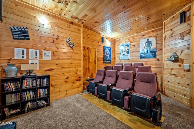 home theater room featuring wooden ceiling, wooden walls, and carpet flooring