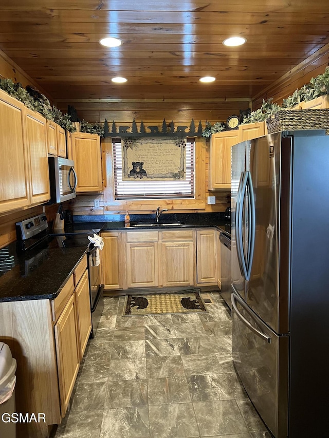 kitchen with a sink, wood ceiling, dark countertops, and appliances with stainless steel finishes