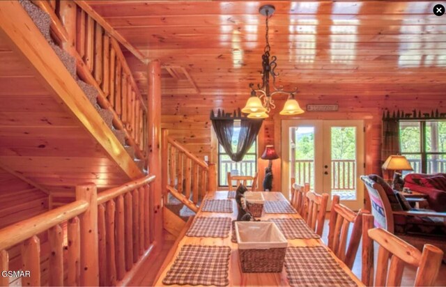 260 Laurel Oaks Way, Gatlinburg, TN 37738 - dining area featuring stairs, french doors, wood finished floors, wooden ceiling, and an inviting chandelier