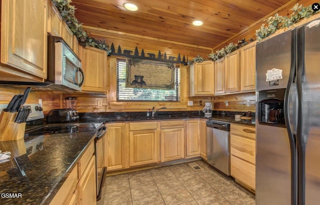 kitchen with recessed lighting, light tile patterned floors, a sink, wood ceiling, and stainless steel appliances