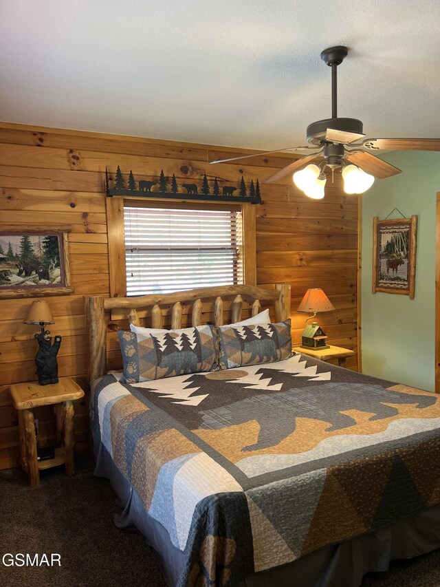 260 Laurel Oaks Way, Gatlinburg, TN 37738 - carpeted bedroom with ceiling fan and wood walls
