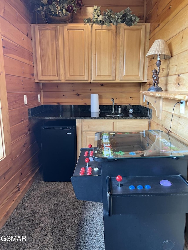 260 Laurel Oaks Way, Gatlinburg, TN 37738 - kitchen with dishwashing machine, light brown cabinetry, wood walls, and a sink