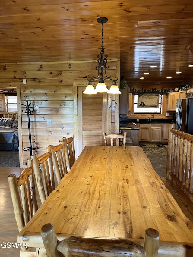 dining space with wood ceiling, an inviting chandelier, and dark wood-style floors