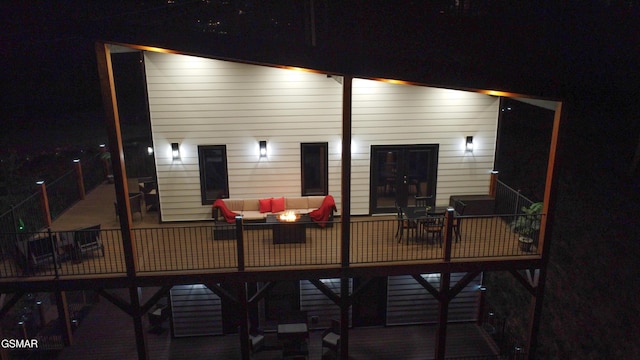 1040 Old Cartertown Rd, Gatlinburg, TN 37738 - back of house at twilight featuring an outdoor living space
