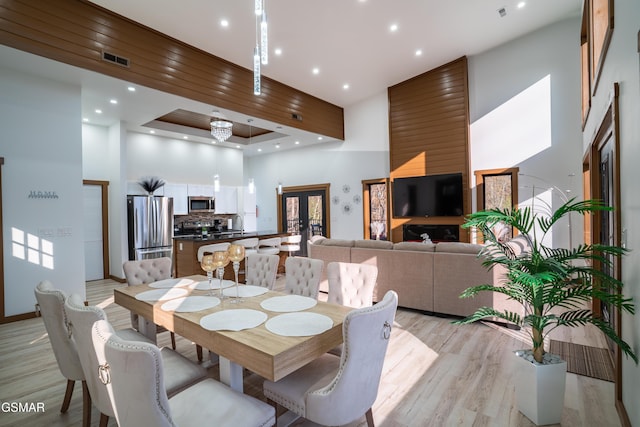 1040 Old Cartertown Rd, Gatlinburg, TN 37738 - dining room featuring a towering ceiling, light wood finished floors, and recessed lighting
