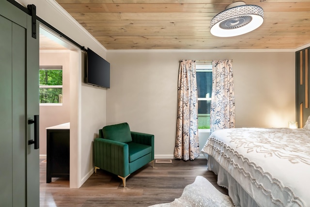 bedroom with a barn door, wood ceiling, and crown molding