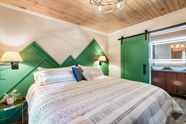 bedroom with wood finished floors, wooden ceiling, crown molding, and a barn door