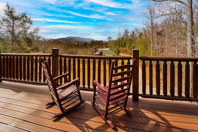 wooden deck featuring a mountain view