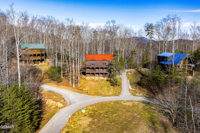 aerial view with a wooded view