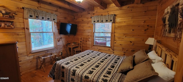 817 Christy Ln, Townsend, TN 37882 - bedroom with wooden walls, wood finished floors, multiple windows, and beam ceiling