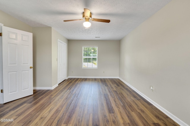 336 Perry Branch Way, Sevierville, TN 37876 - unfurnished bedroom with dark wood-style floors, a textured ceiling, baseboards, a closet, and a ceiling fan