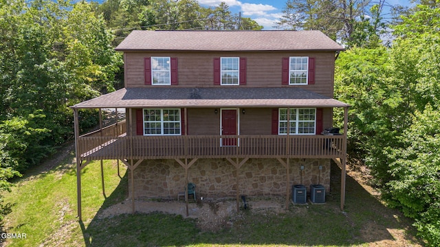 336 Perry Branch Way, Sevierville, TN 37876 - view of front of property featuring stone siding, a shingled roof, a wooden deck, and a front lawn