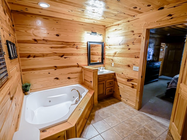 bathroom featuring wood ceiling, vanity, tile patterned flooring, a bathing tub, and wood walls