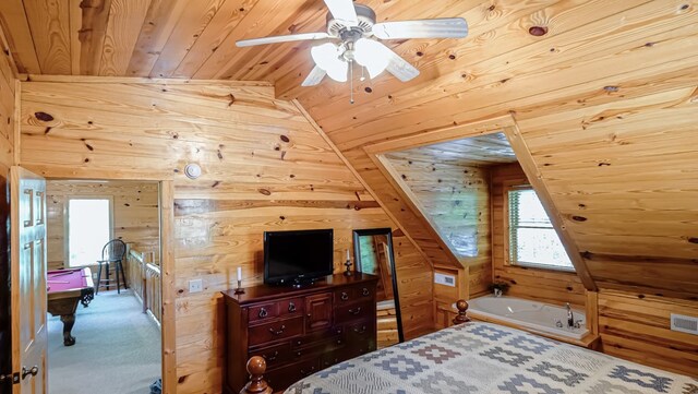 carpeted bedroom featuring wood walls, ceiling fan, wooden ceiling, and vaulted ceiling