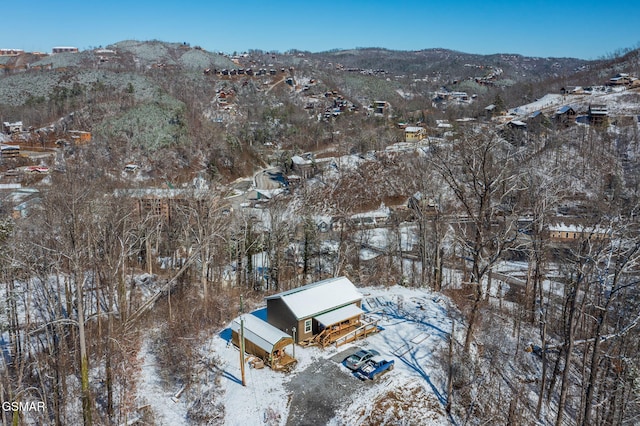 snowy aerial view with a mountain view