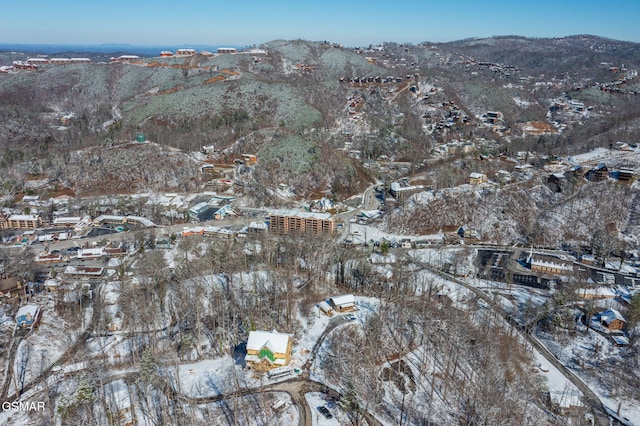 snowy aerial view with a mountain view