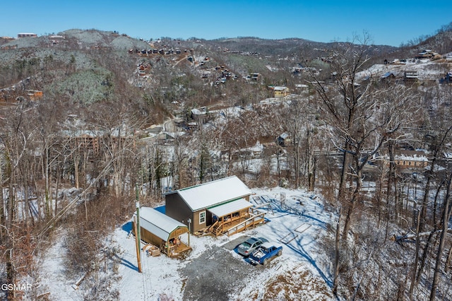 snowy aerial view with a mountain view