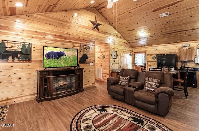 living room with wood walls and wooden ceiling