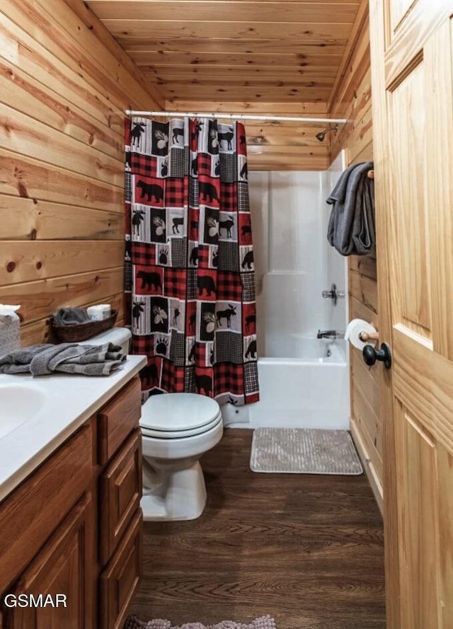 bathroom featuring wooden walls, wood ceiling, toilet, and wood finished floors