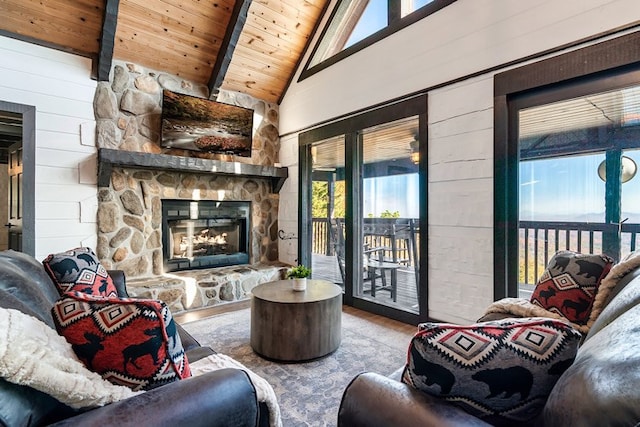 living room featuring beamed ceiling, wood walls, wood ceiling, and high vaulted ceiling